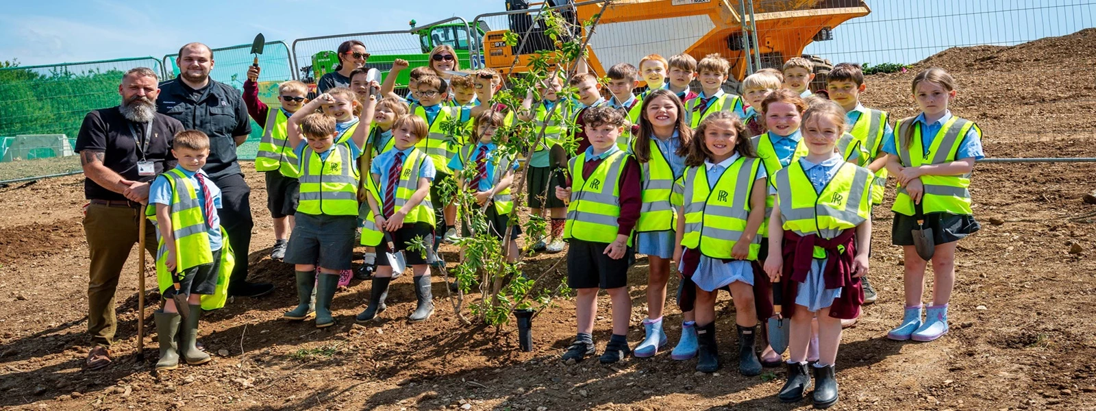 Local schoolchildren plant first new tree on Rolls-Royce extension site